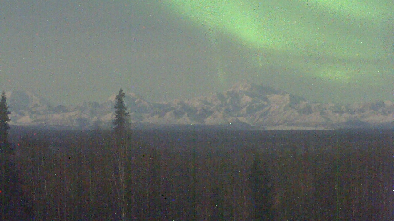 Denali by moonlight with some northern lights